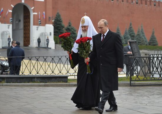President Putin lays flowers at Minin and Pozharsky monument on Red Square