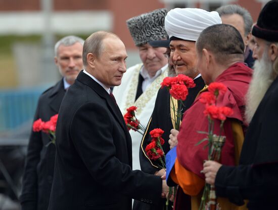 President Putin lays flowers at Minin and Pozharsky monument on Red Square