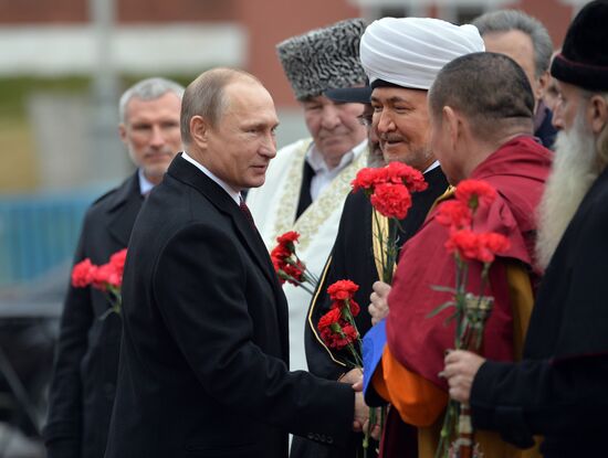 President Putin lays flowers at Minin and Pozharsky monument on Red Square