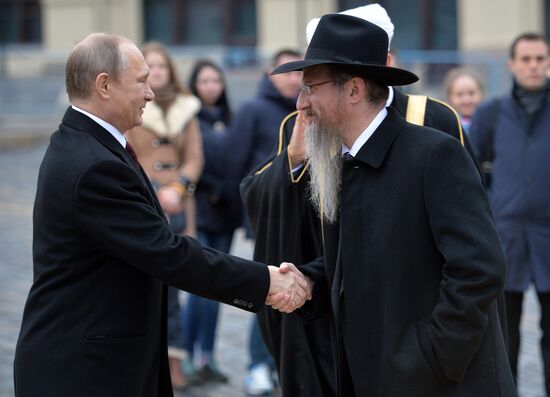 President Putin lays flowers at Minin and Pozharsky monument on Red Square