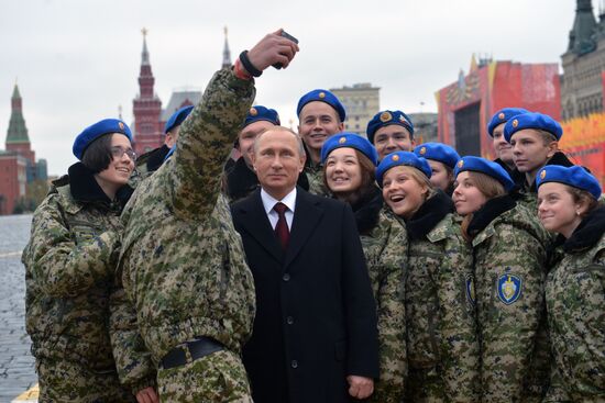 President Putin lays flowers at Minin and Pozharsky monument on Red Square