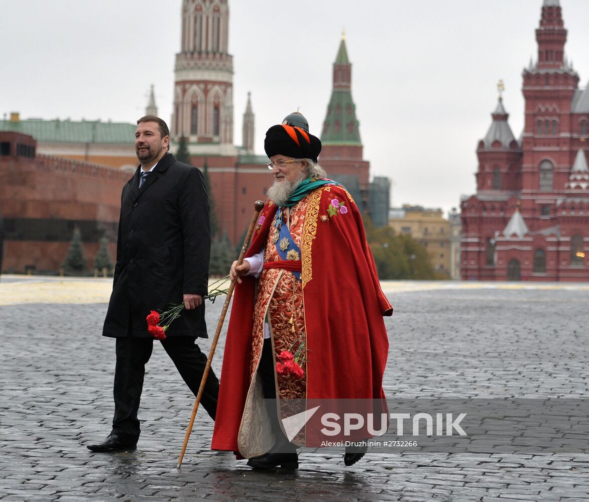 President Putin lays flowers at Minin and Pozharsky monument on Red Square