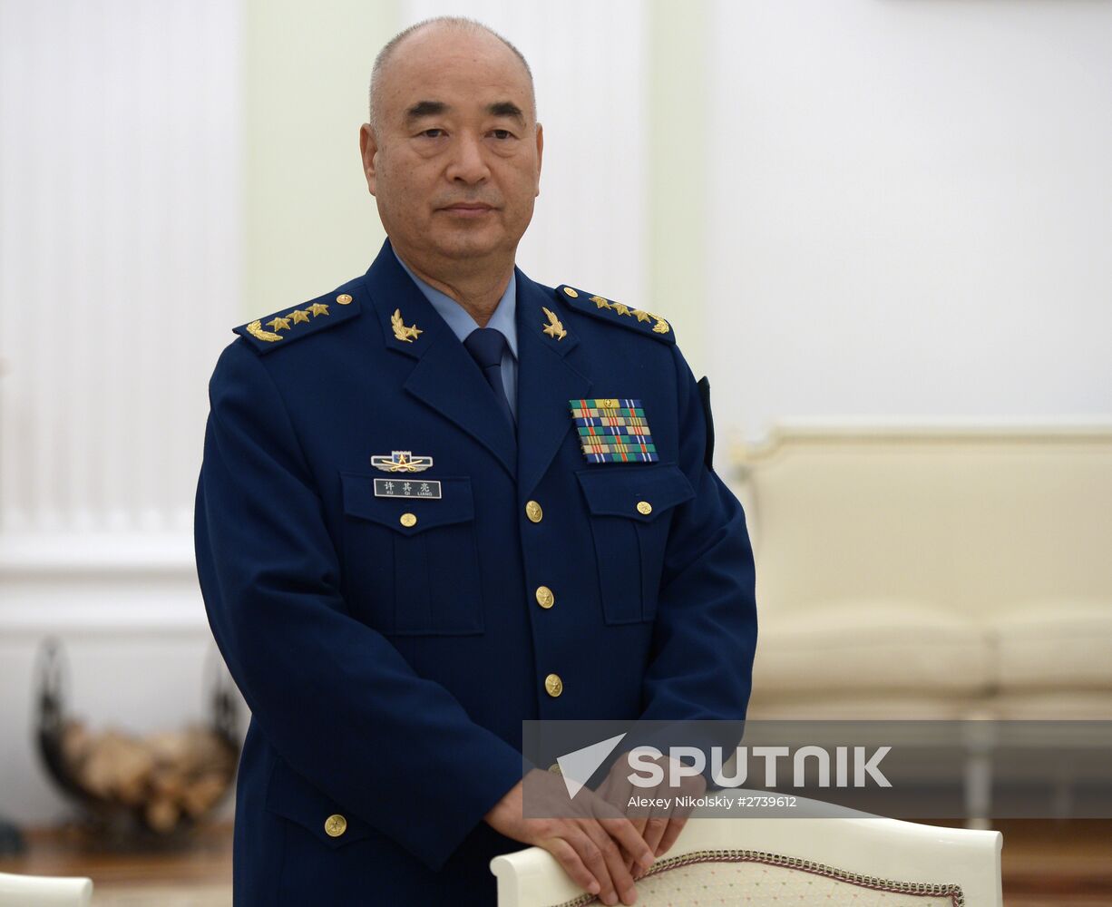 Russian President Vladimir Putin meets with Vice Chairman of China's Central Military Commission Xu Qiliang