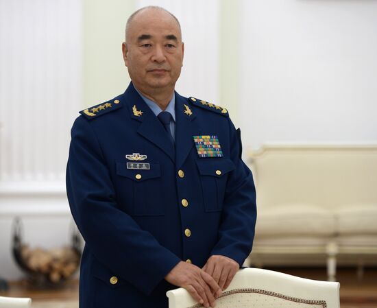 Russian President Vladimir Putin meets with Vice Chairman of China's Central Military Commission Xu Qiliang