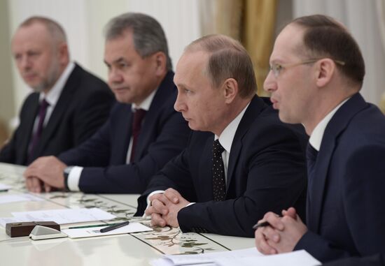Russian President Vladimir Putin meets with Vice Chairman of China's Central Military Commission Xu Qiliang