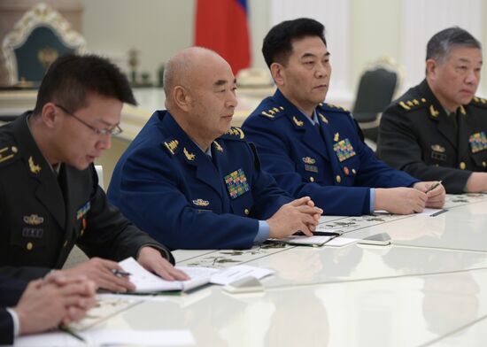 Russian President Vladimir Putin meets with Vice Chairman of China's Central Military Commission Xu Qiliang