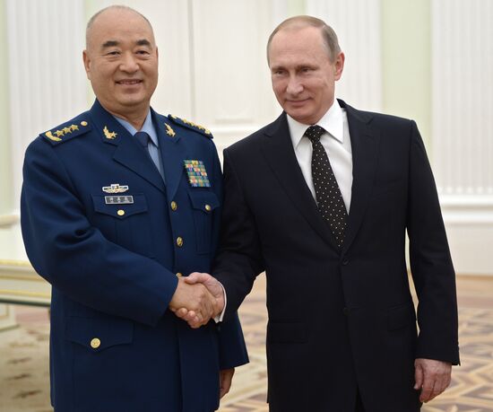 Russian President Vladimir Putin meets with Vice Chairman of China's Central Military Commission Xu Qiliang