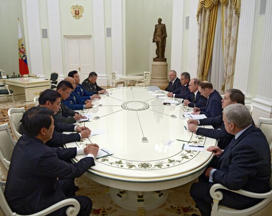 Russian President Vladimir Putin meets with Vice Chairman of China's Central Military Commission Xu Qiliang