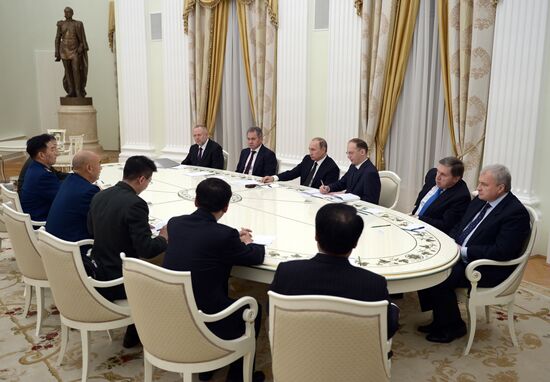 Russian President Vladimir Putin meets with Vice Chairman of China's Central Military Commission Xu Qiliang