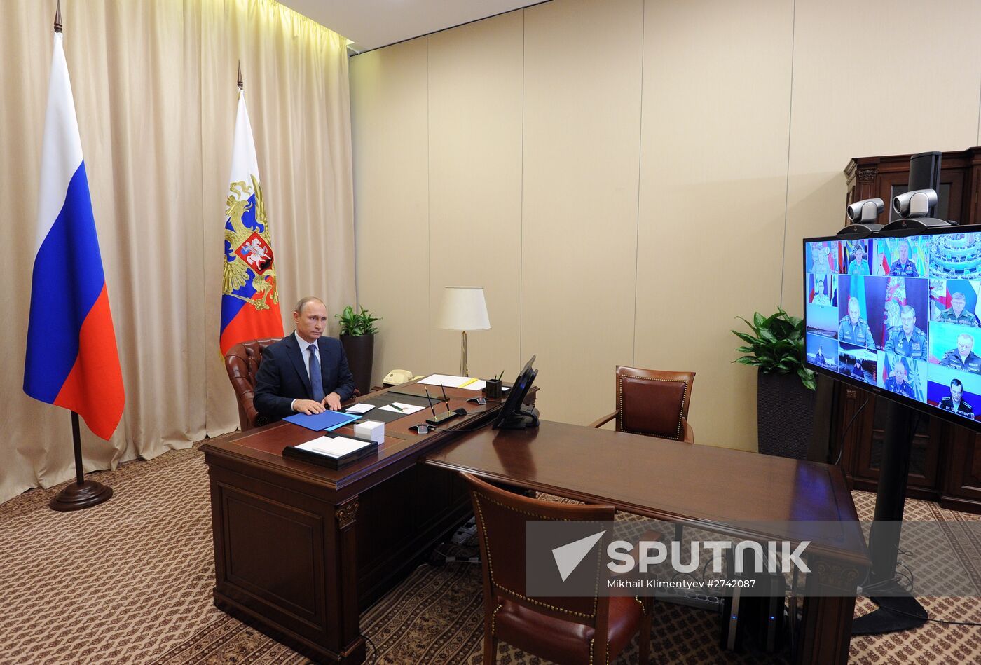 Russian President Vladimir Putin holds video conference with Russian military personnel in Syria