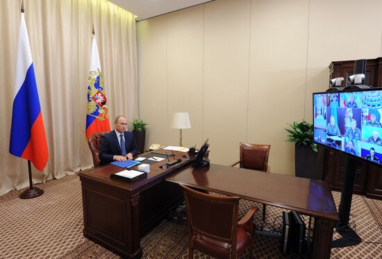Russian President Vladimir Putin holds video conference with Russian military personnel in Syria