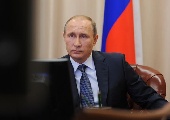 Russian President Vladimir Putin holds video conference with Russian military personnel in Syria
