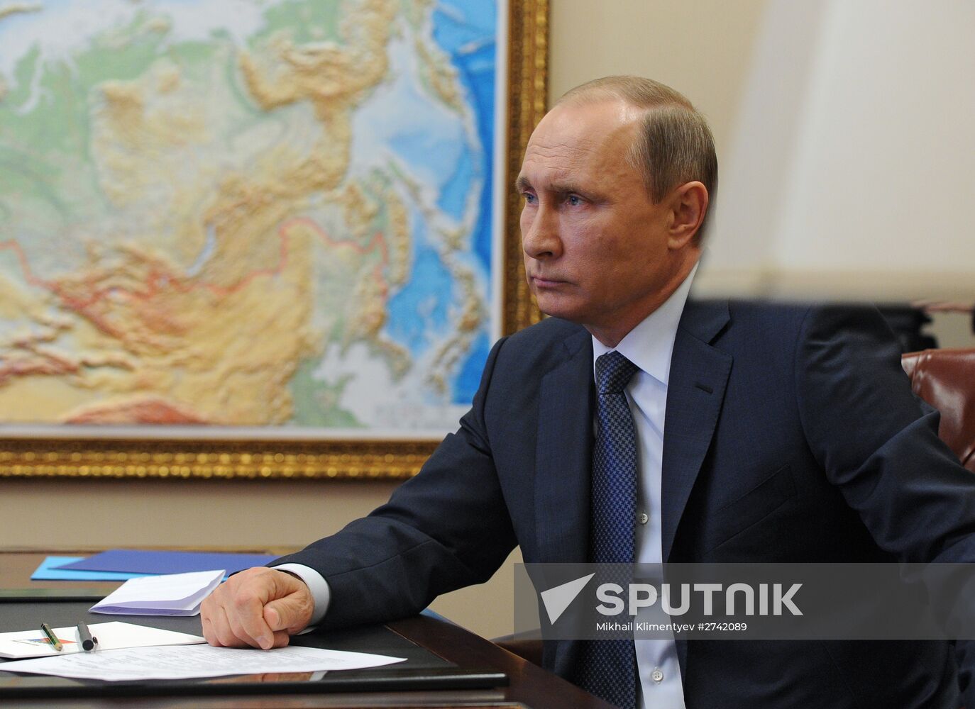 Russian President Vladimir Putin holds video conference with Russian military personnel in Syria