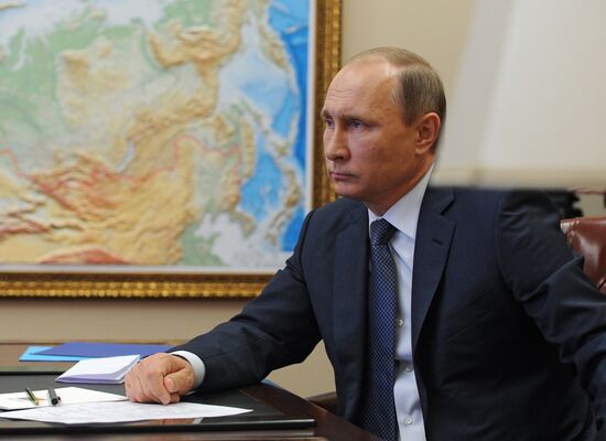 Russian President Vladimir Putin holds video conference with Russian military personnel in Syria