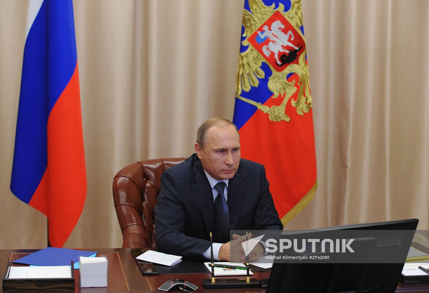Russian President Vladimir Putin holds video conference with Russian military personnel in Syria
