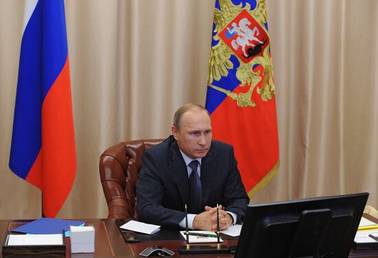 Russian President Vladimir Putin holds video conference with Russian military personnel in Syria