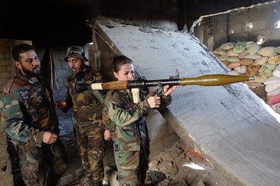 Soldiers of the Syrian Arab Army in Darayya, a Damascus suburb