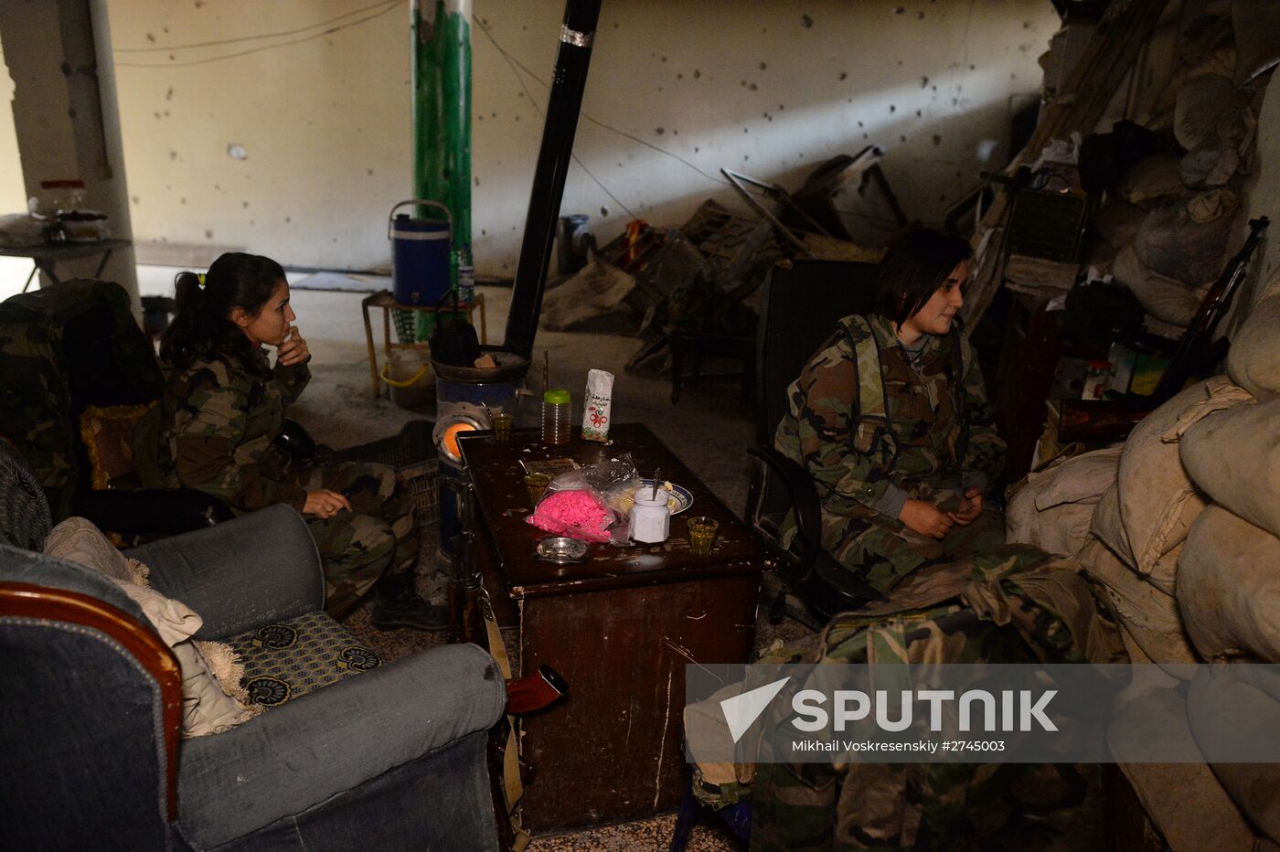 Soldiers of the Syrian Arab Army in Darayya, a Damascus suburb