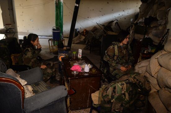 Soldiers of the Syrian Arab Army in Darayya, a Damascus suburb