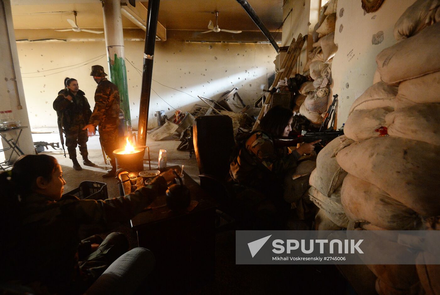 Soldiers of the Syrian Arab Army in Darayya, a Damascus suburb