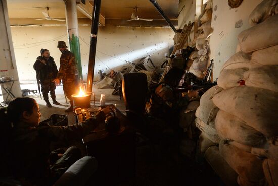 Soldiers of the Syrian Arab Army in Darayya, a Damascus suburb