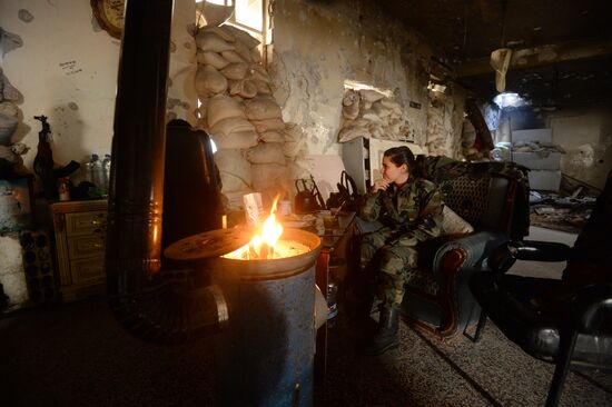 Soldiers of the Syrian Arab Army in Darayya, a Damascus suburb