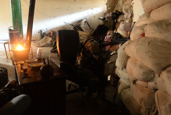 Soldiers of the Syrian Arab Army in Darayya, a Damascus suburb