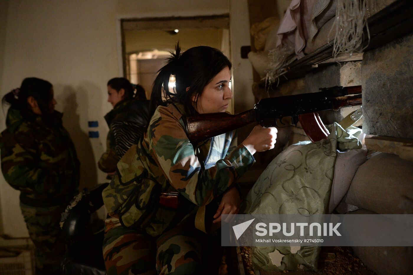 Soldiers of the Syrian Arab Army in Darayya, a Damascus suburb
