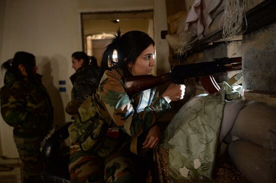 Soldiers of the Syrian Arab Army in Darayya, a Damascus suburb