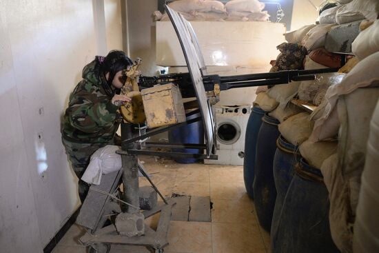 Soldiers of the Syrian Arab Army in Darayya, a Damascus suburb