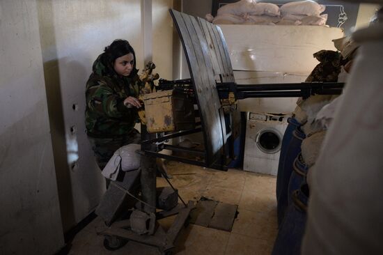 Soldiers of the Syrian Arab Army in Darayya, a Damascus suburb
