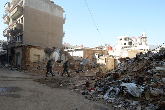 Soldiers of the Syrian Arab Army in Darayya, a Damascus suburb