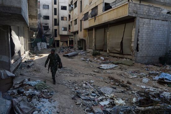 Soldiers of the Syrian Arab Army in Darayya, a Damascus suburb