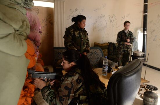 Soldiers of the Syrian Arab Army in Darayya, a Damascus suburb