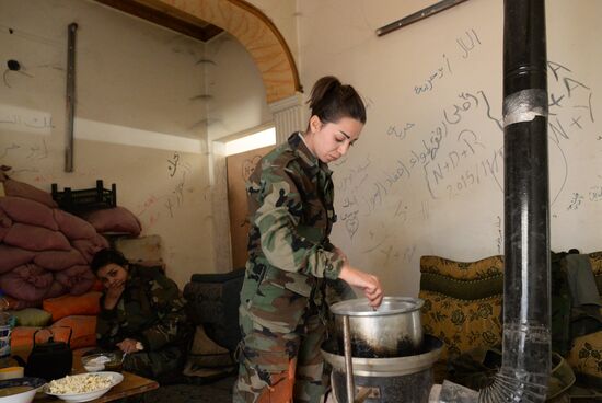 Soldiers of the Syrian Arab Army in Darayya, a Damascus suburb