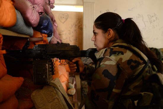 Soldiers of the Syrian Arab Army in Darayya, a Damascus suburb