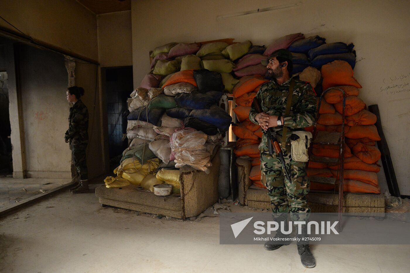 Soldiers of the Syrian Arab Army in Darayya, a Damascus suburb