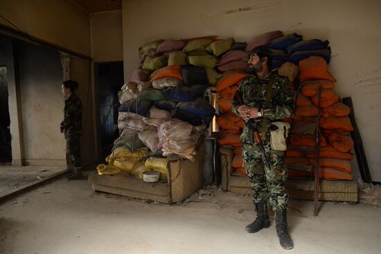 Soldiers of the Syrian Arab Army in Darayya, a Damascus suburb