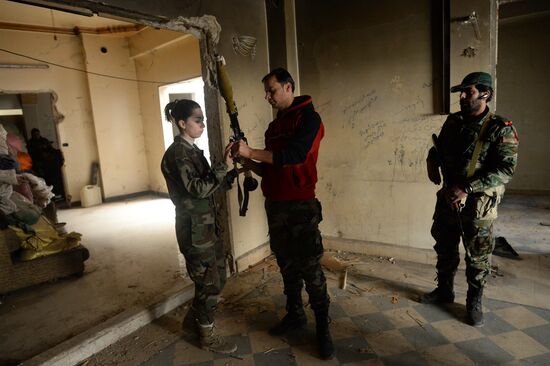 Soldiers of the Syrian Arab Army in Darayya, a Damascus suburb