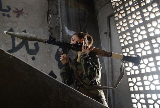 Soldiers of the Syrian Arab Army in Darayya, a Damascus suburb