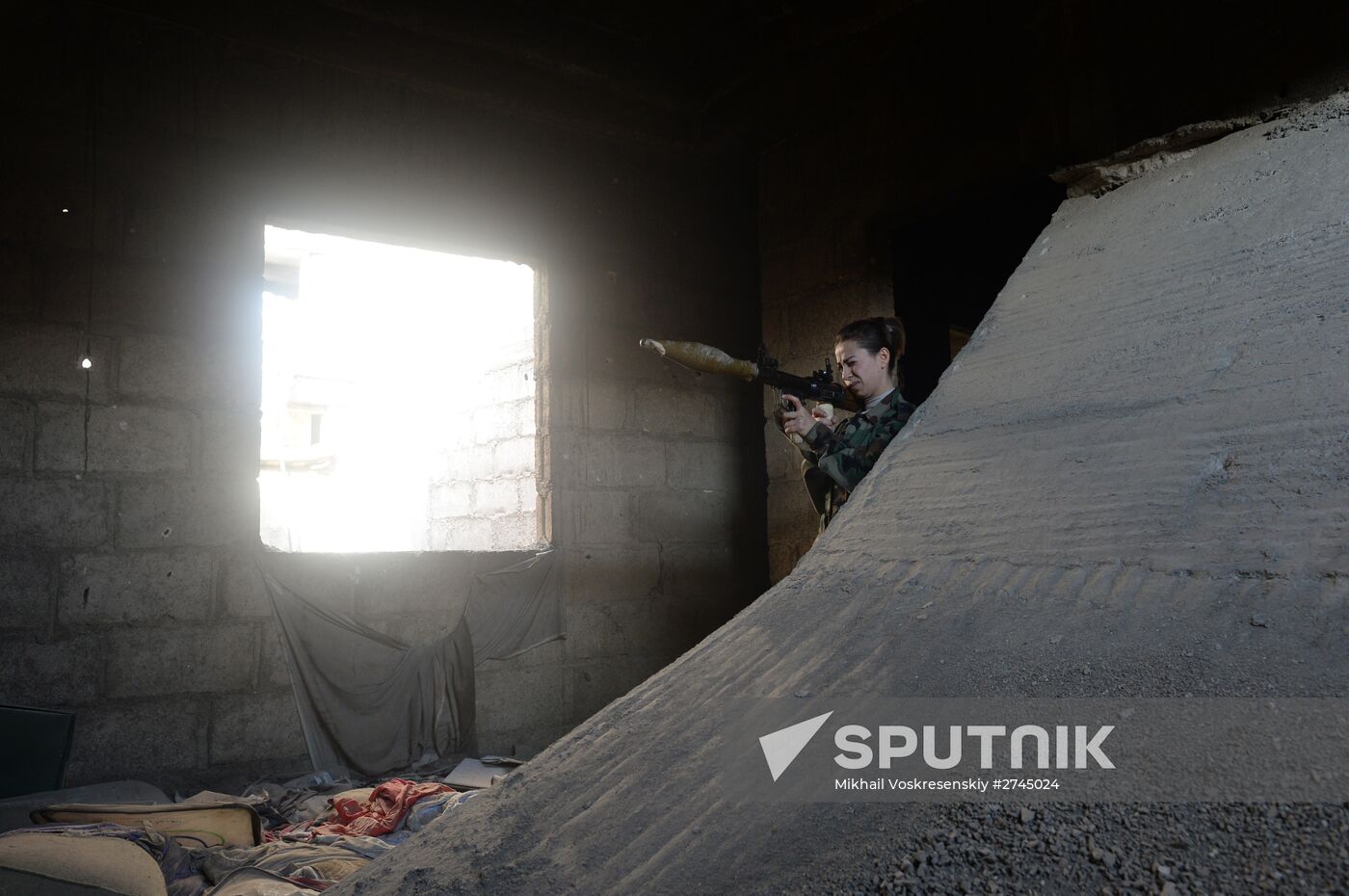 Soldiers of the Syrian Arab Army in Darayya, a Damascus suburb