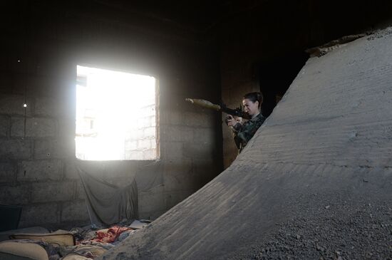 Soldiers of the Syrian Arab Army in Darayya, a Damascus suburb