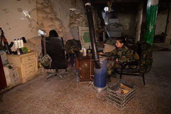 Soldiers of the Syrian Arab Army in Darayya, a Damascus suburb