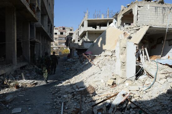 Soldiers of the Syrian Arab Army in Darayya, a Damascus suburb