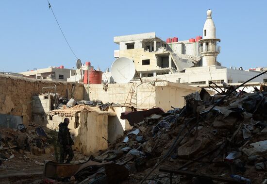 Soldiers of the Syrian Arab Army in Darayya, a Damascus suburb.