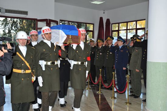 Coffin with body of Russian pilot Oleg Peshkov flown from Turkey to Russia