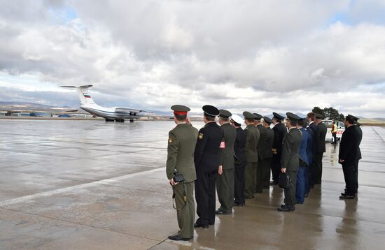 Coffin with body of Russian pilot Oleg Peshkov flown from Turkey to Russia