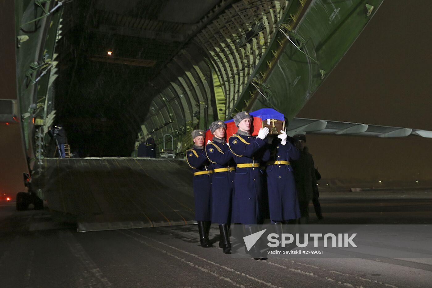 Sergei Shoigu and Viktor Bondarev greet aircraft carrying body of Su-24 commander Oleg Peshkov at Chkalovsky airport