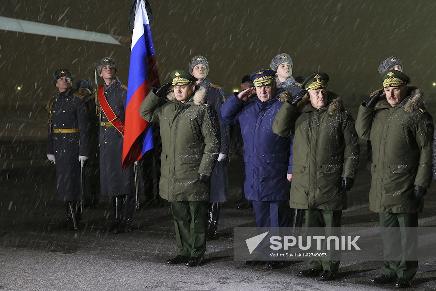 Sergei Shoigu and Viktor Bondarev greet aircraft carrying body of Su-24 commander Oleg Peshkov at Chkalovsky airport