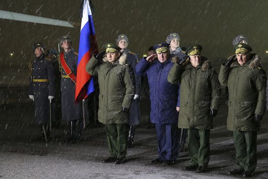 Sergei Shoigu and Viktor Bondarev greet aircraft carrying body of Su-24 commander Oleg Peshkov at Chkalovsky airport